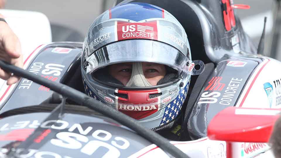 Marco Andretti sits in his 98 car